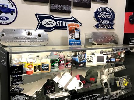 Shop display with car parts and Ford signs | Powerstroke Performance & Repairs