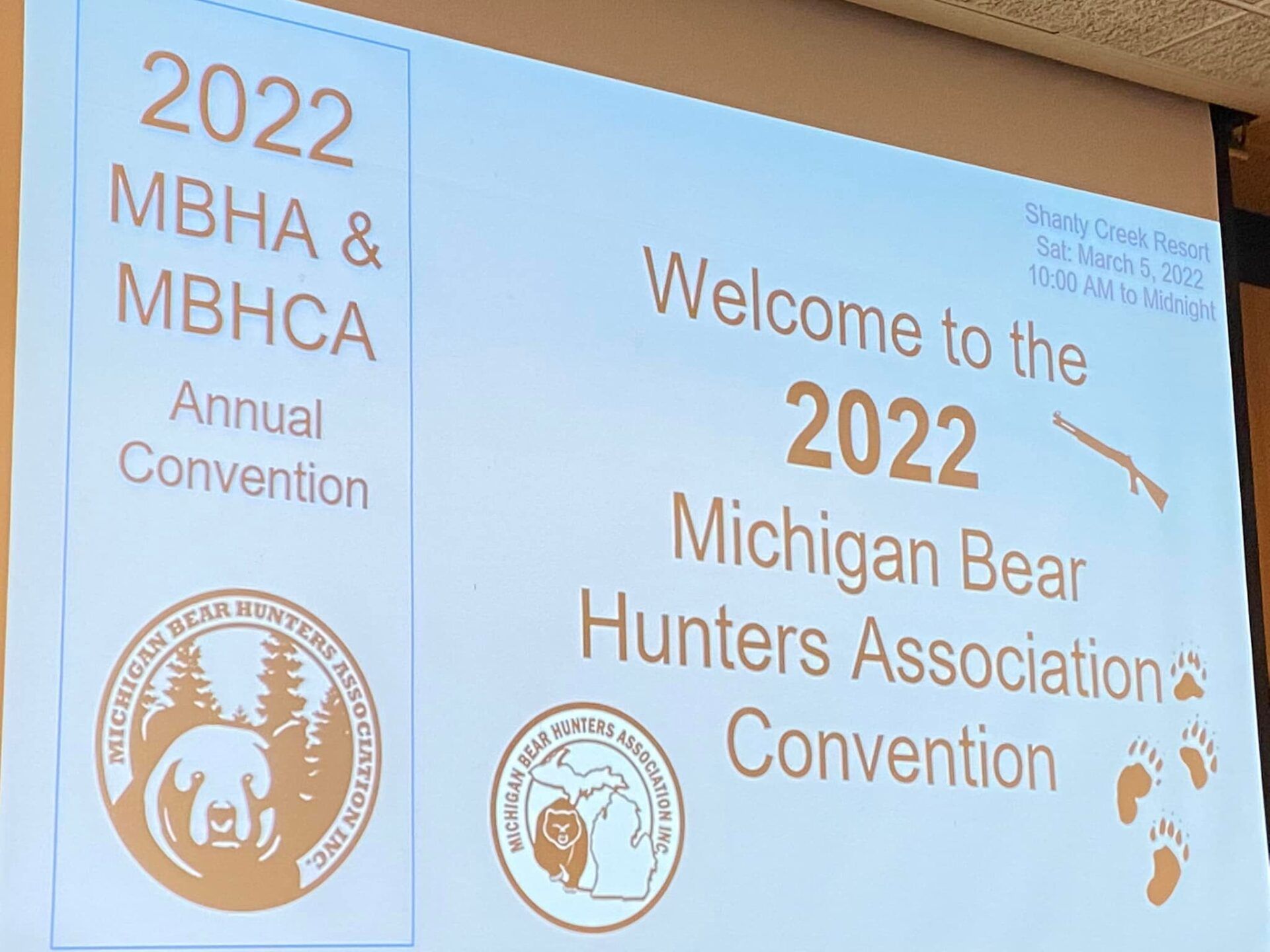 A sign that says welcome to the 2022 michigan bear hunters association convention