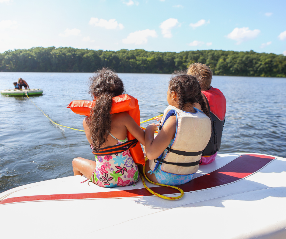 Playing on the lake with boats
