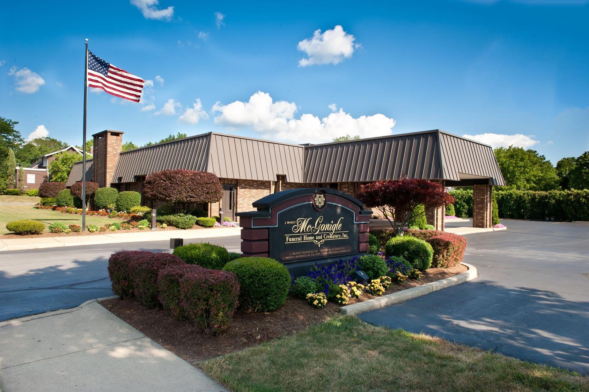 Sign and building with an American flag;