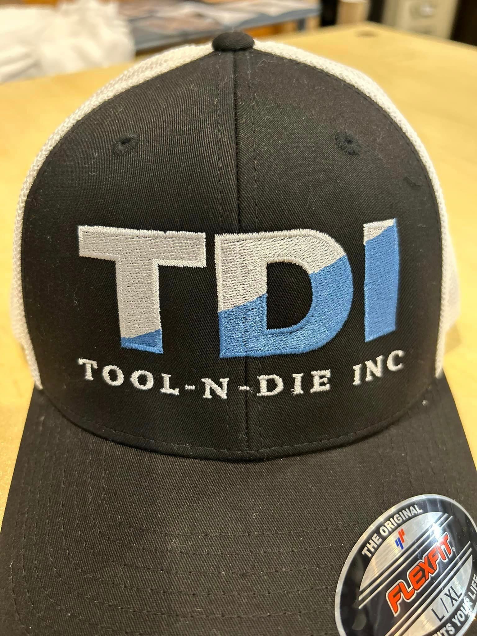A black and white mesh baseball cap featuring the embroidered blue and silver
