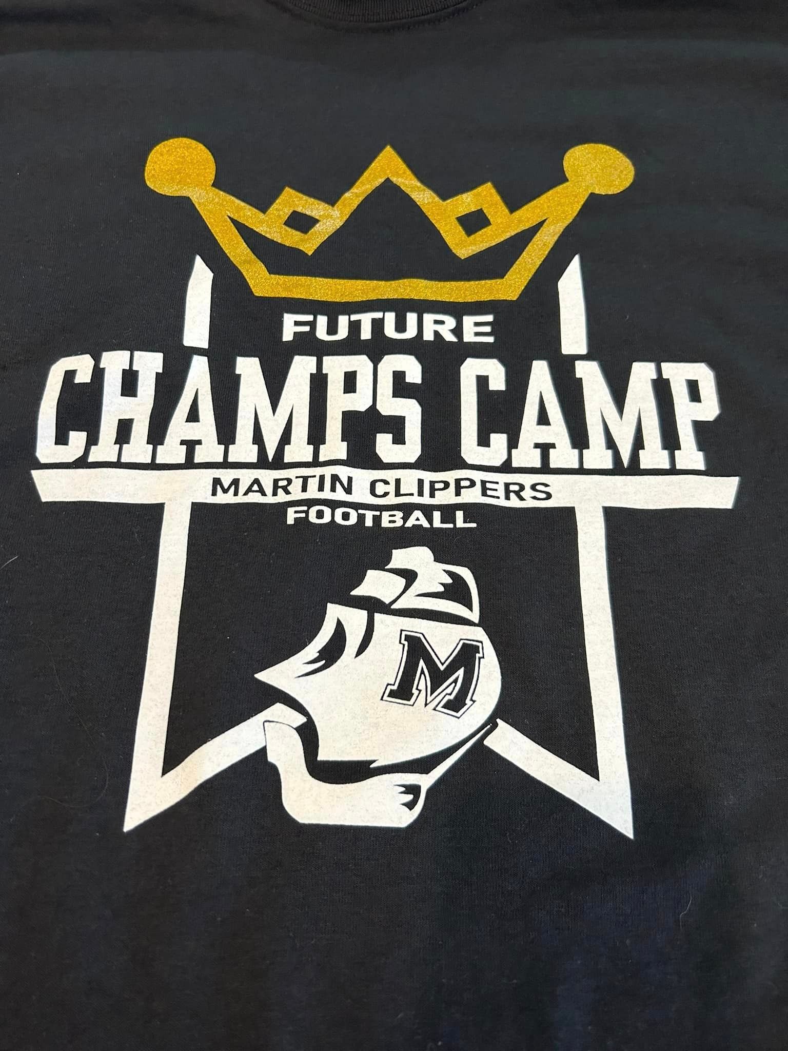 A black shirt with a gold crown over