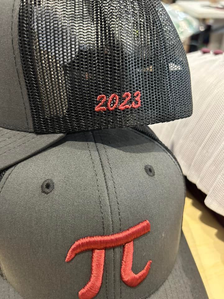 A gray baseball cap with a red pi symbol on the front and