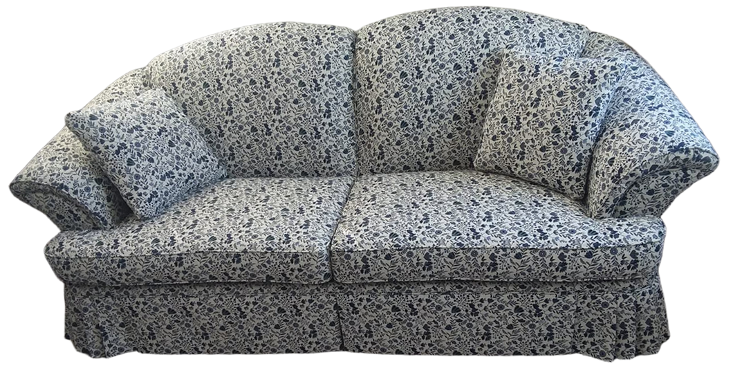 Gray patterned upholstered loveseat with rolled arms and a tufted back