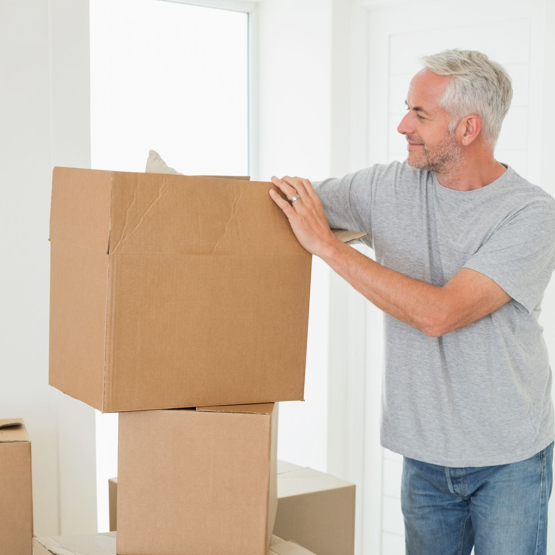 elderly man with boxes