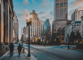 picture of a city with people walking