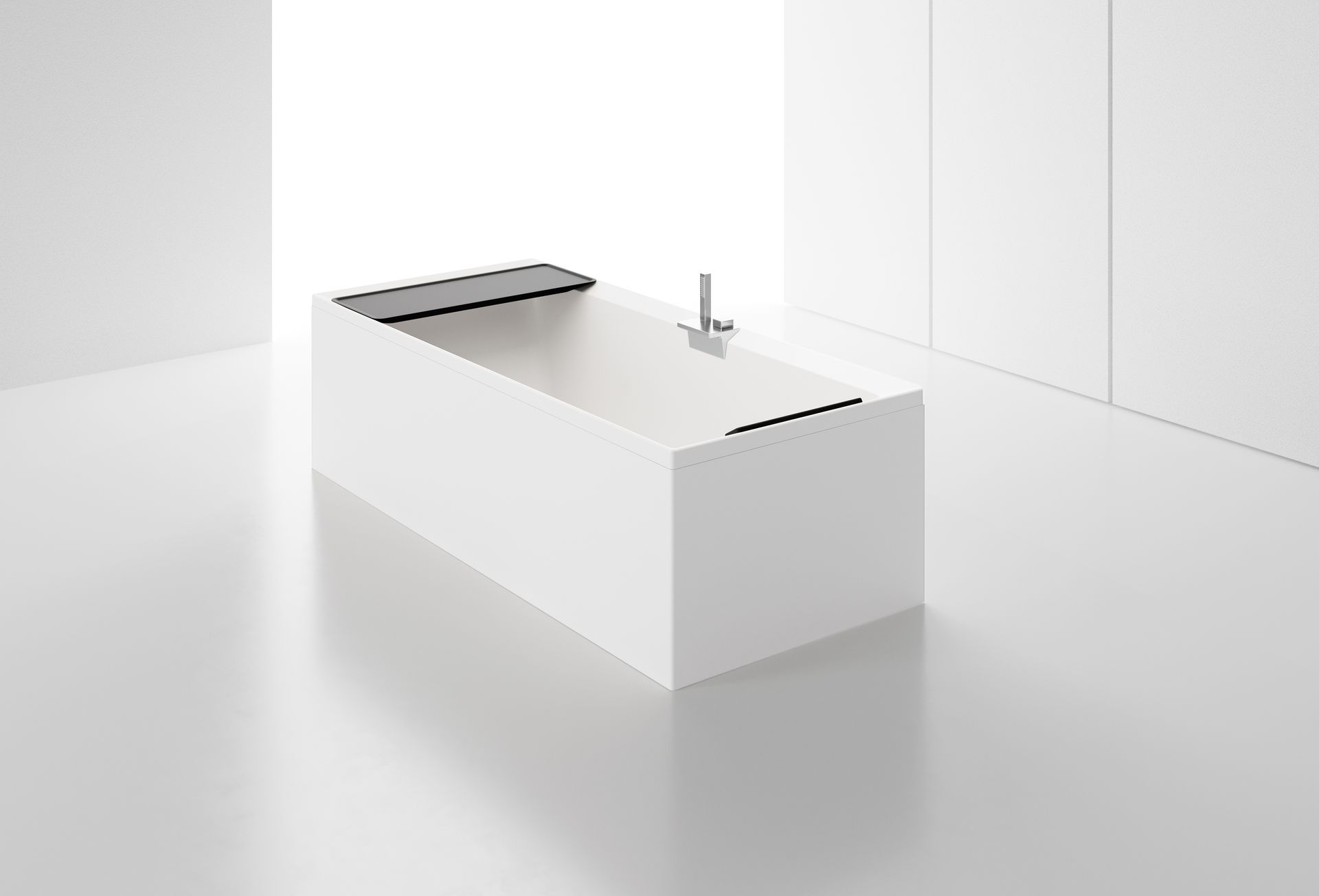 A white bathtub is sitting on a white floor in a bathroom.