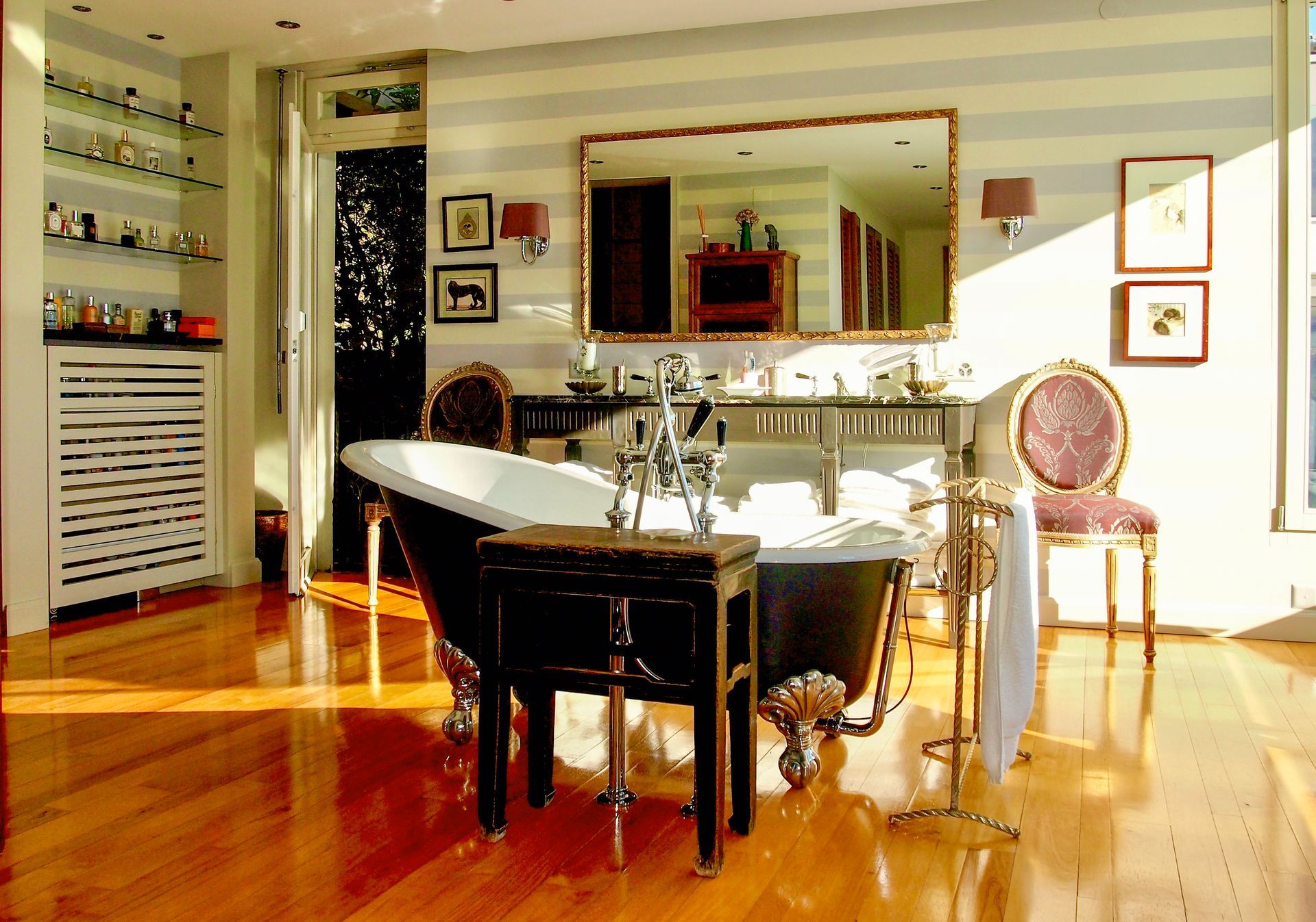 A bathroom with a large tub and a mirror