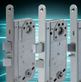 Three silver-colored metal mortise door locks stand in a row against a glowing blue digital background.