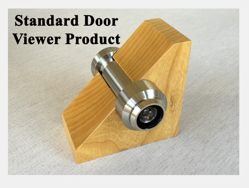 A metal door viewer is mounted through a triangular wooden block to demonstrate how the product fits in a door.