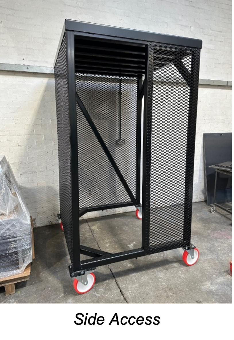 Black metal cage cart on casters with side access, featuring a mesh design, standing in a warehouse setting.