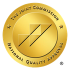 The Joint Commission seal, gold, with text