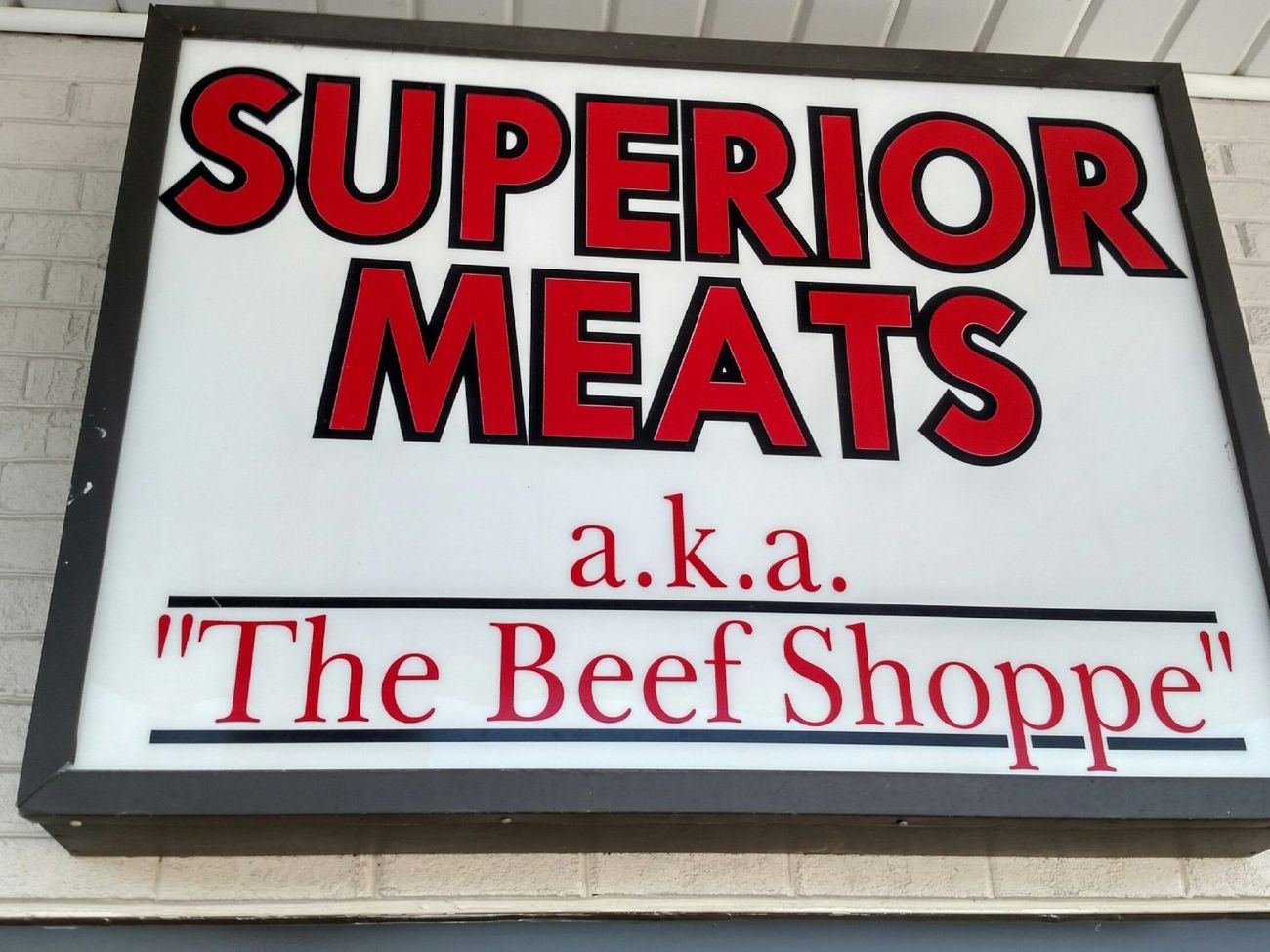 Superior Meats sign with red and black lettering, reading “a.k.a. The Beef Shoppe.”