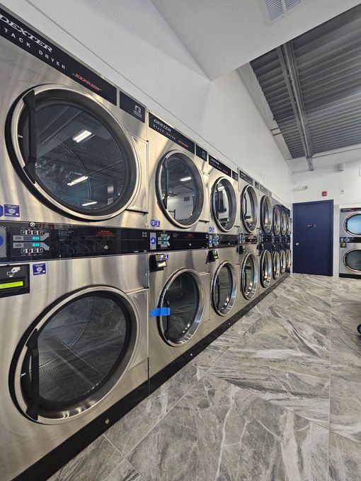 Inside Union Laundry: a row of commercial dryers.