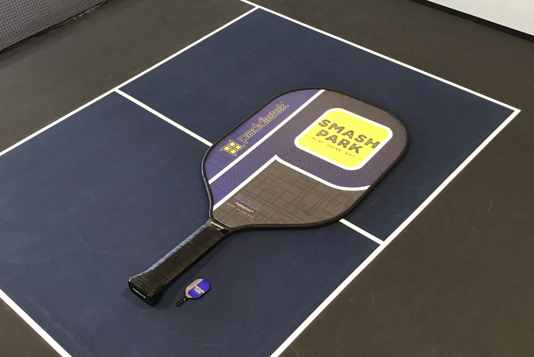 Largest pickleball paddle: Smash Park