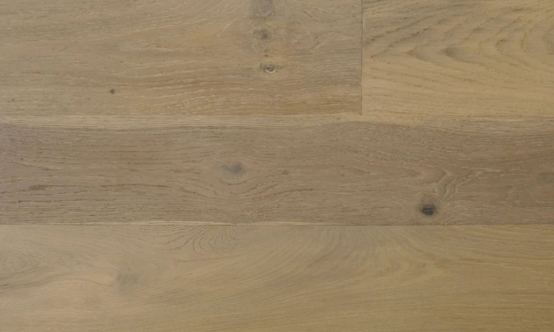 A close up of a wooden floor with a grain and texture.
