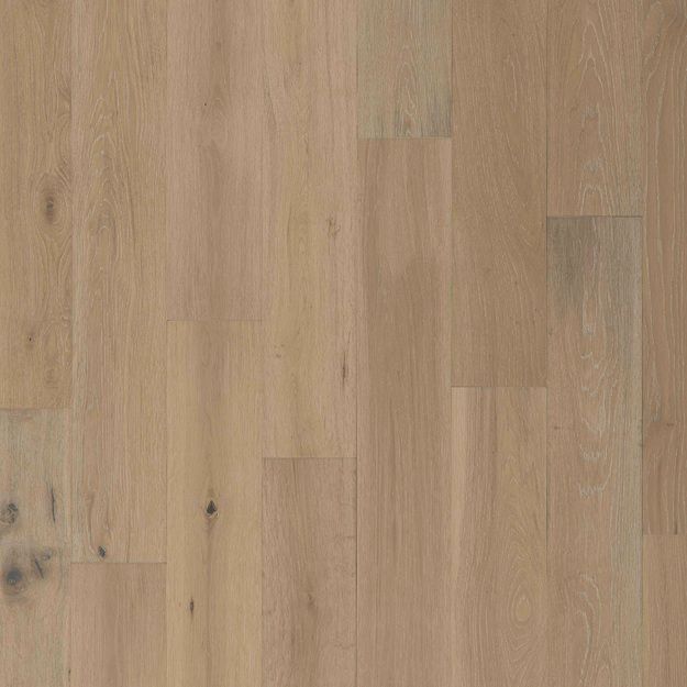 A close up of a light brown wooden floor.