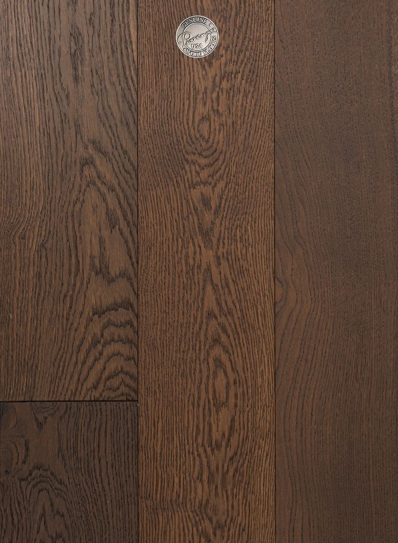 A close up of a wooden floor with a diamond in the middle.