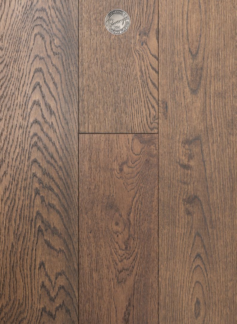 A close up of a wooden floor with a hole in it.