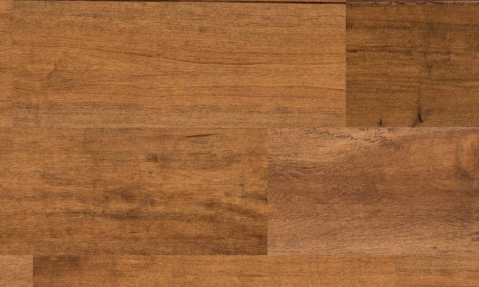 A close up of a wooden floor with a grain and texture.