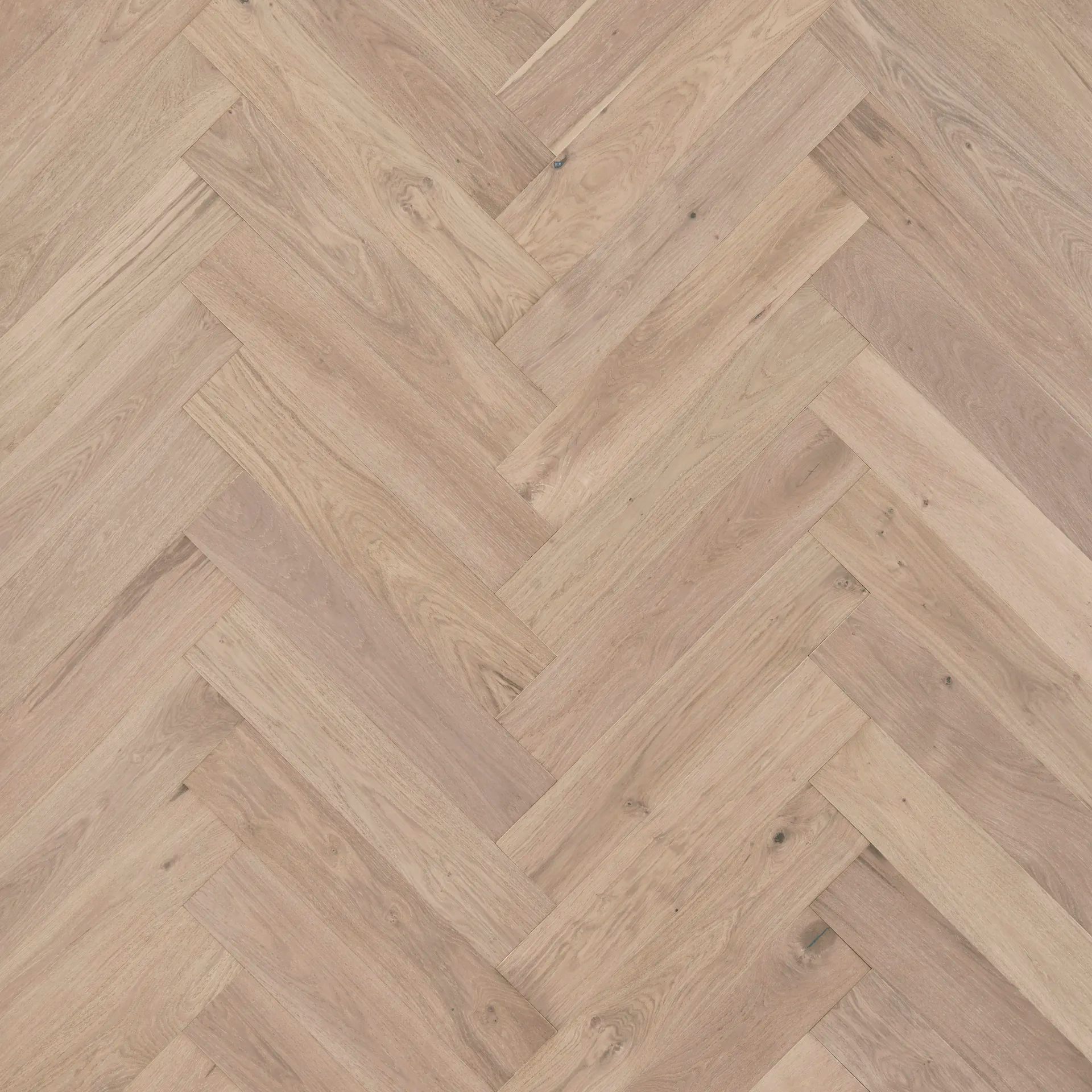 A close up of a herringbone wooden floor.