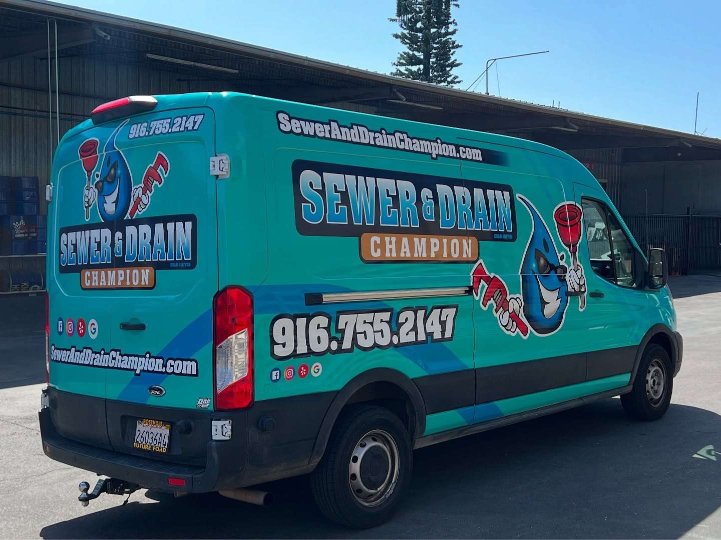 Turquoise Sewer Drain Champion service van with logo and phone number parked outdoors
