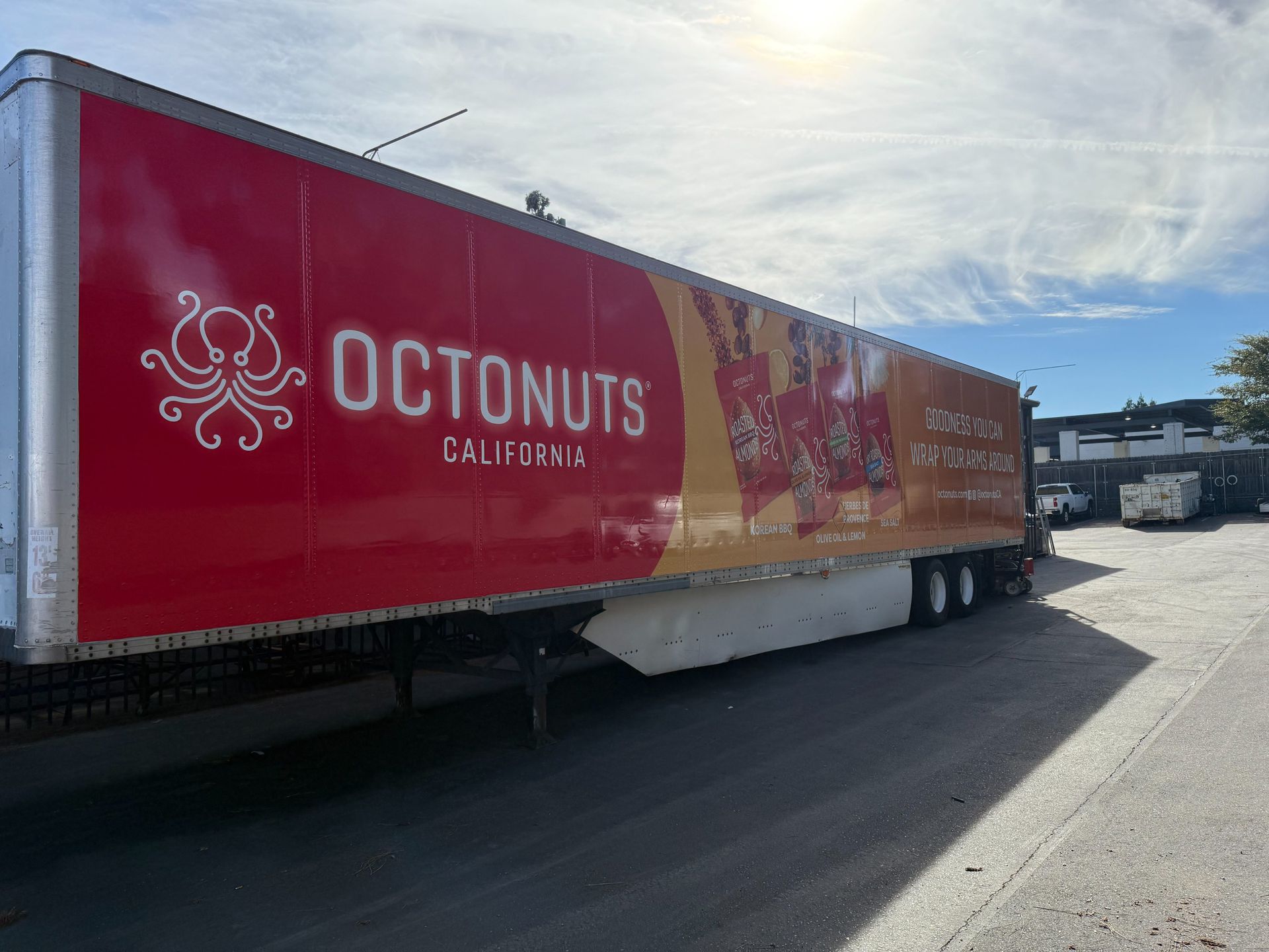Red Octonuts California delivery trailer parked in a sunny lot