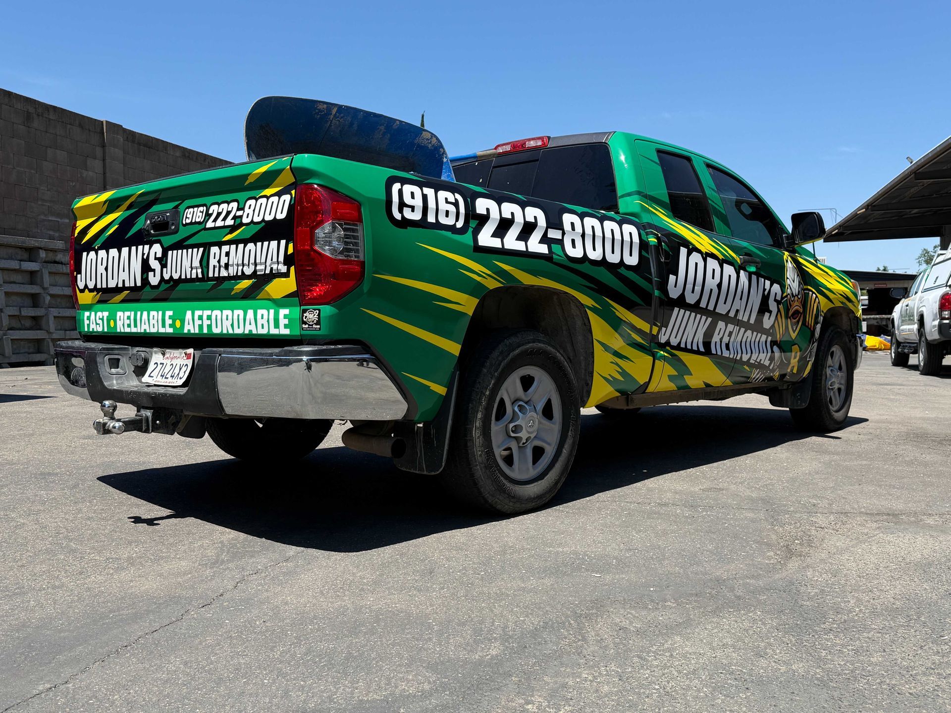 Green Jobrani’s Air Ducts service van parked outdoors with phone number and logo graphics