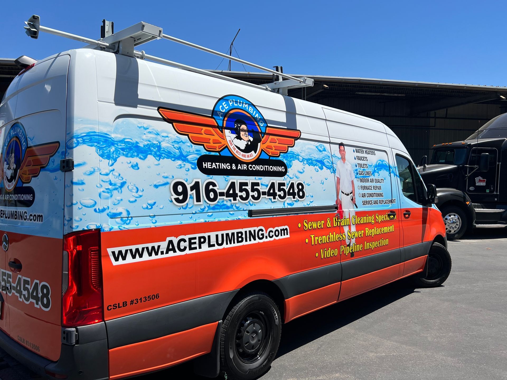 an ace plumbing van is parked in a parking lot
