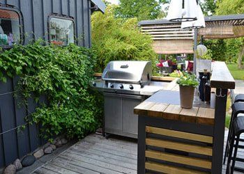 Blended outdoor kitchen and counter top Outdoor kitchen and counter top blended with garden in Carson City