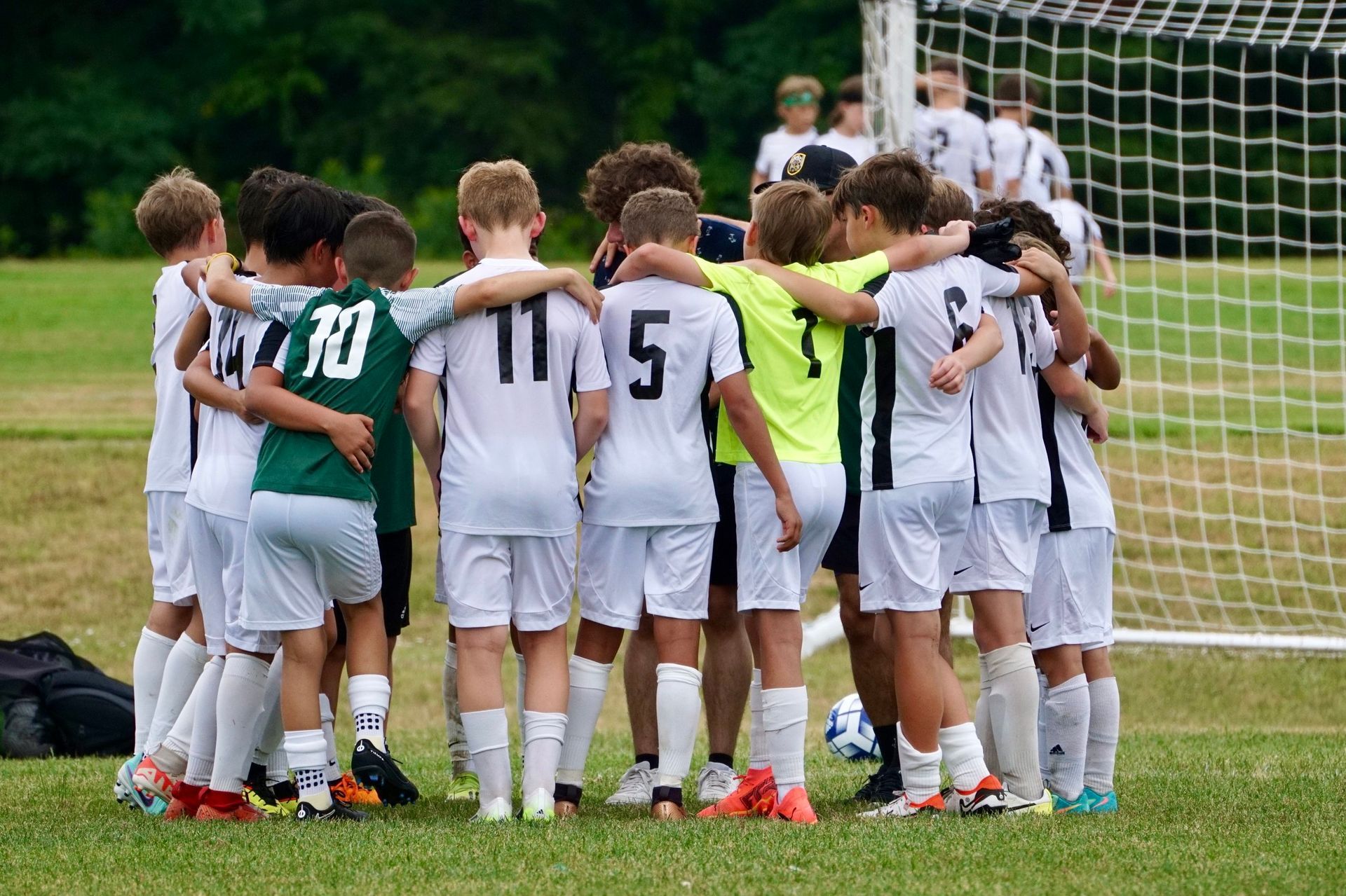 Christos FC USL Youth team huddle