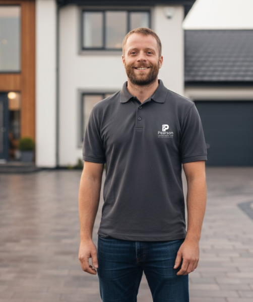 Gareth Pearson founder of Pearson Landscapes standing beside a Pearson Landscapes van in Glasgow
