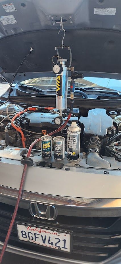 A car is being serviced with the hood open - Sean's Auto Care