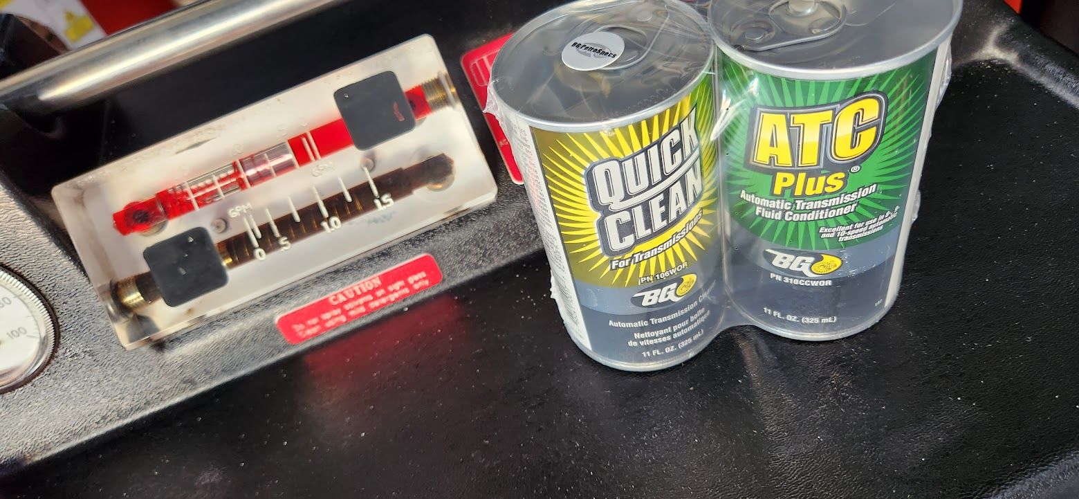 Two cans of quick clear are sitting next to each other on a table - Sean's Auto Care