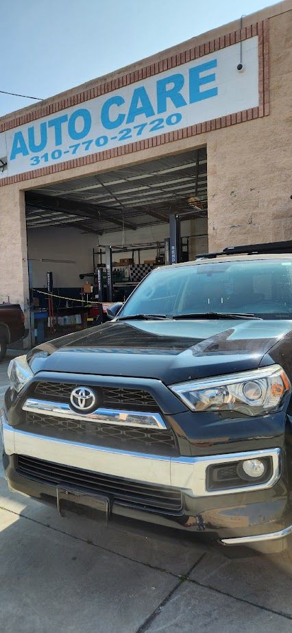 A toyota 4runner is parked in front of an auto care shop - Sean's Auto Care
