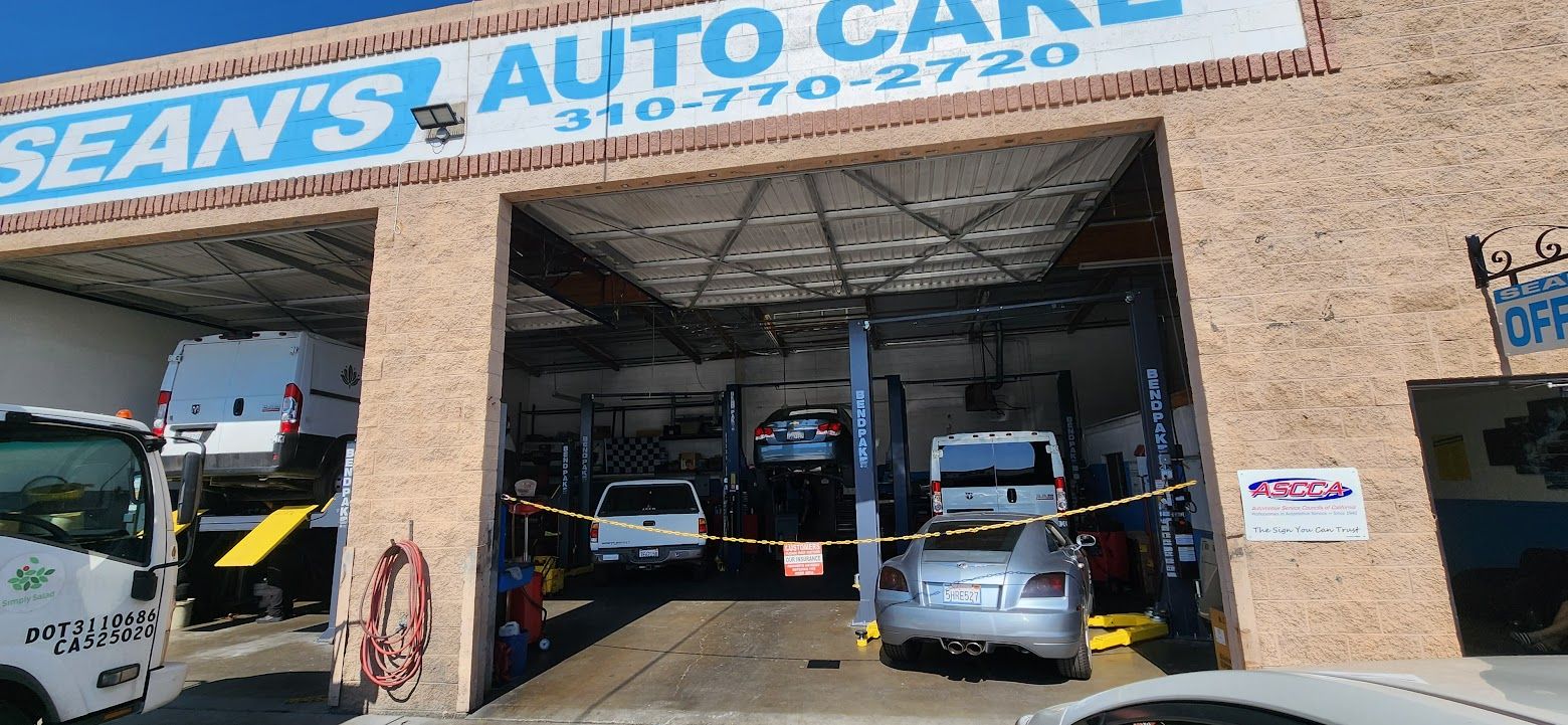 A car is being repaired at sean 's auto care - Sean's Auto Care