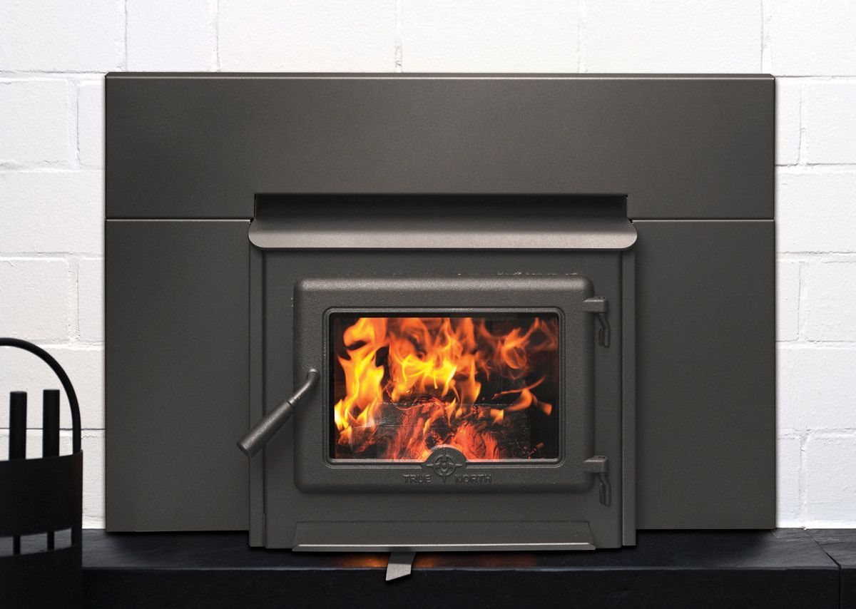Black Wood Stove With a Bright Fire Burning — Tolga Traders in Tolga, QLD