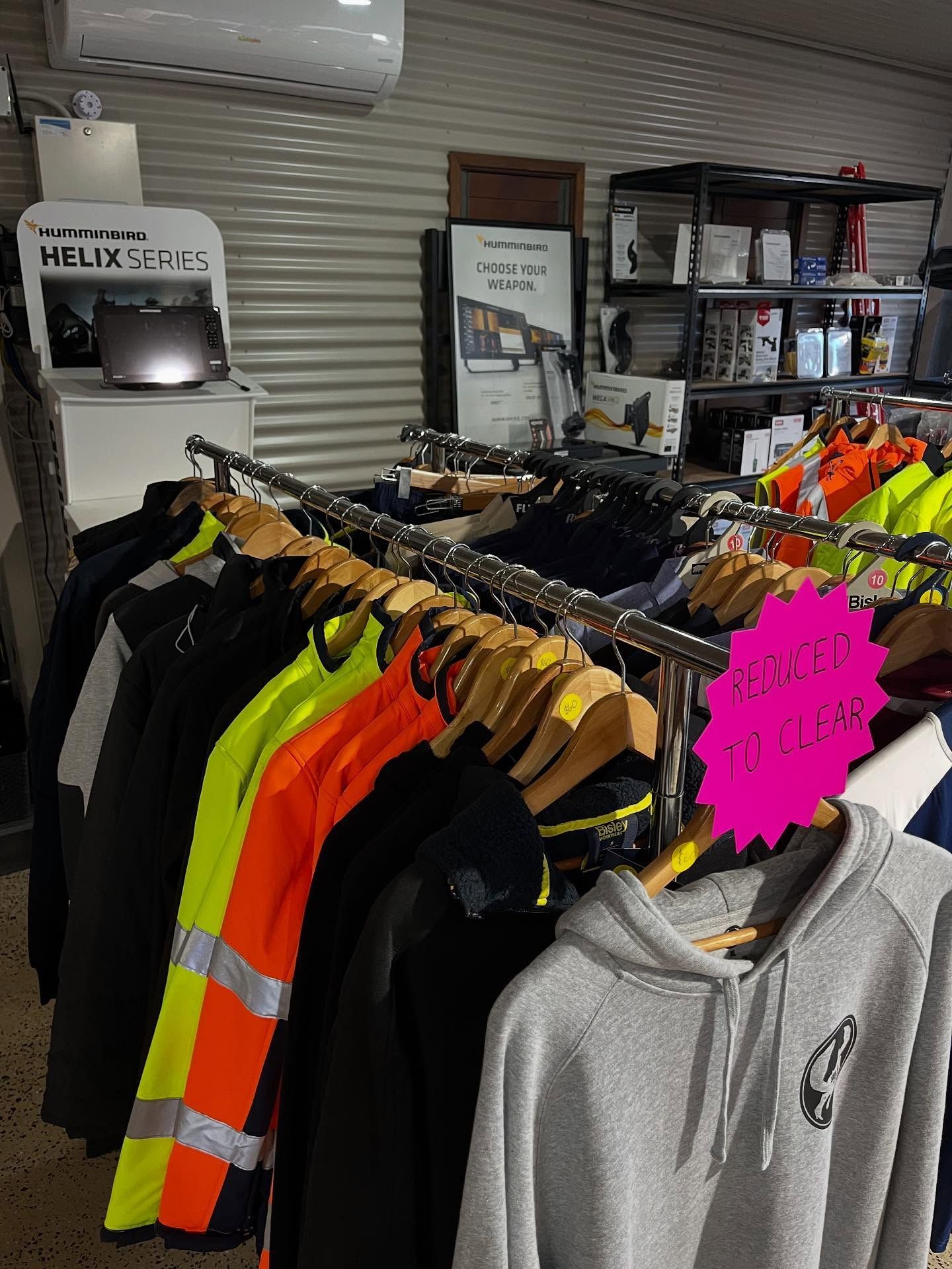 Clothing Rack With High-visibility Jackets — Tolga Traders in Tolga, QLD