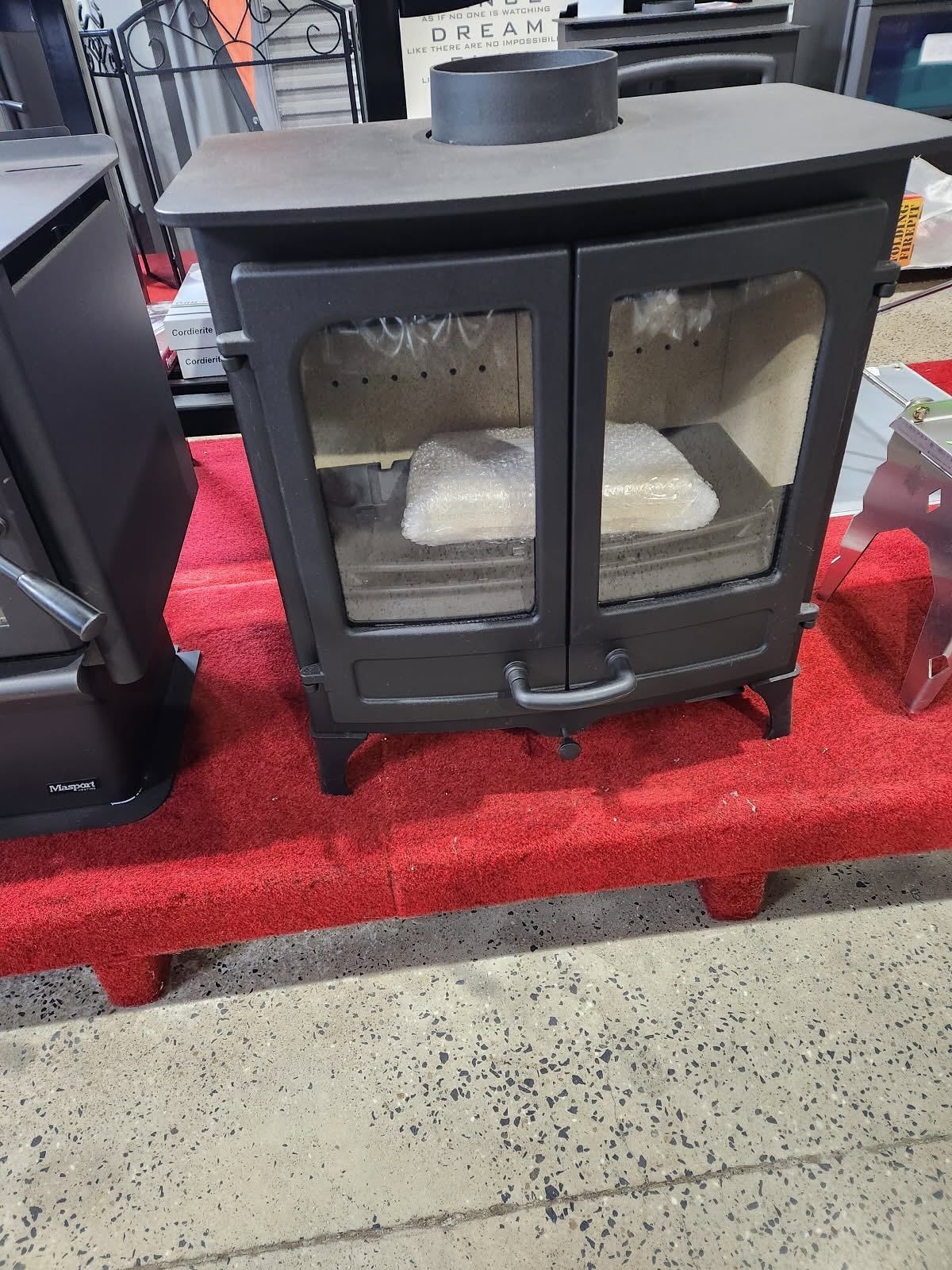 Black Wood-burning Stove With Double Glass Doors — Tolga Traders in Tolga, QLD