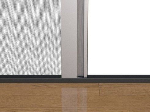 Primo piano di una porta a soffietto su un pavimento in legno.