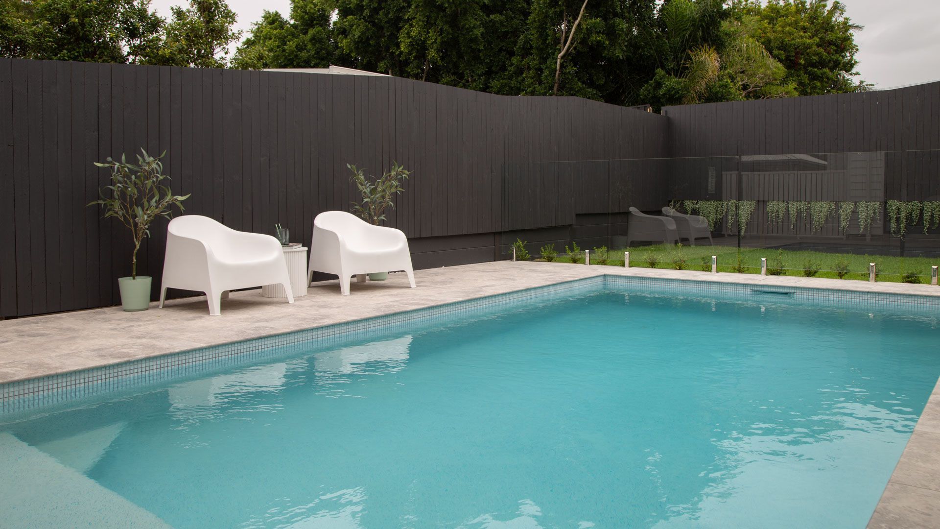 Concrete swimming pool at a residential property
