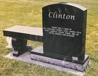 Black granite memorial bench engraved with