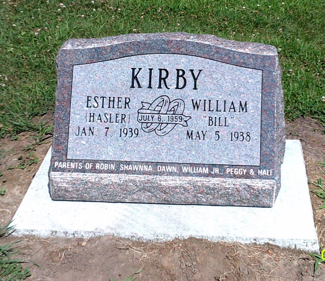 A granite grave marker for the Kirby family, listing Esther and William, their birth dates, and names of their children.