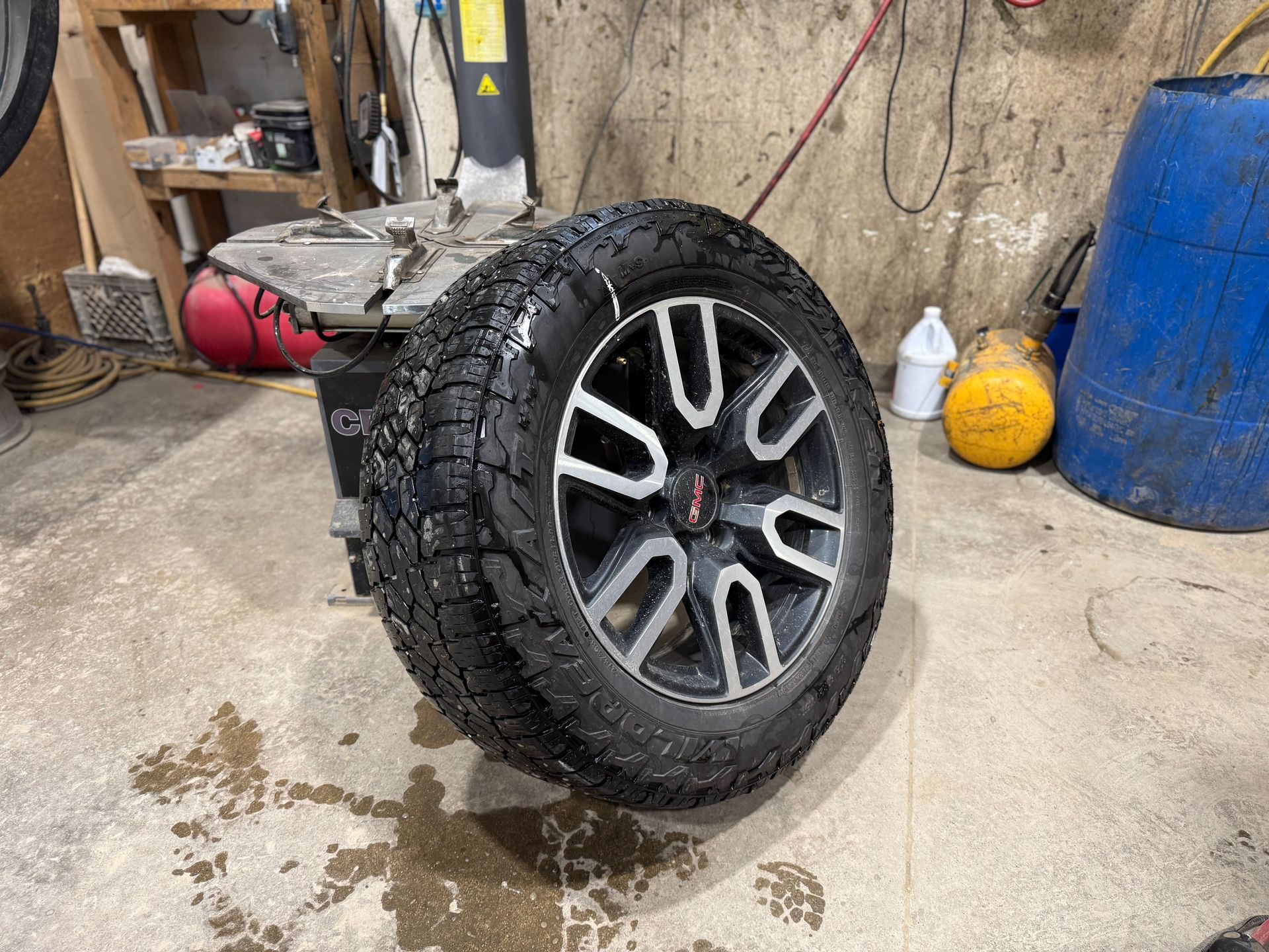 Technician fitting a tire in a Crested Butte tire bay