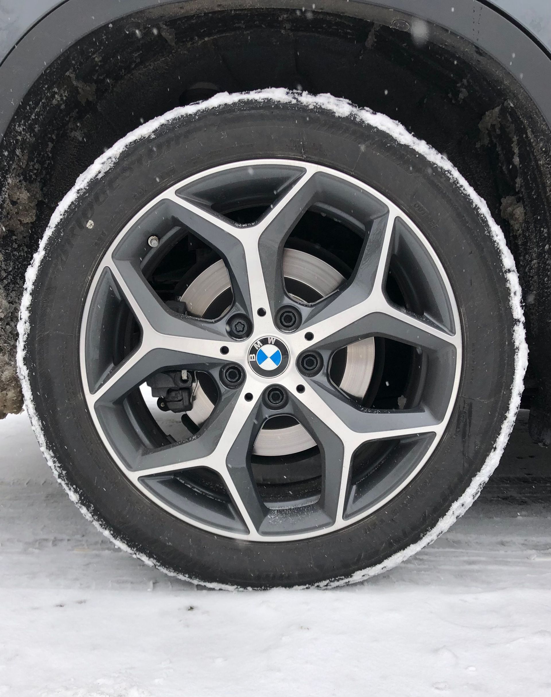 Technician checking winter tire tread in Crested Butte