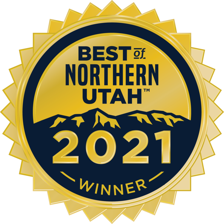 Gold and navy Best of Northern Utah 2021 winner seal with mountain silhouette and sunburst border