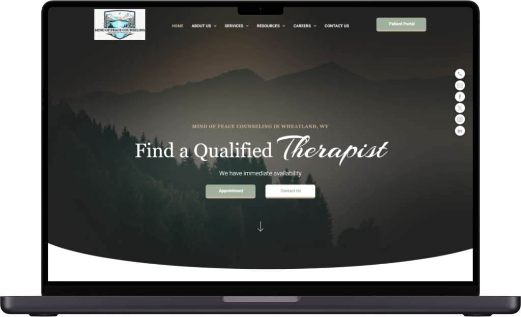 Laptop screen displaying a professional website with a mountain landscape background titled 