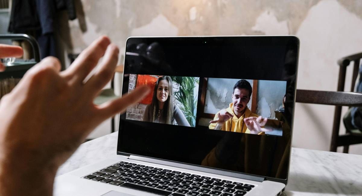 People looking at a meeting on a screen