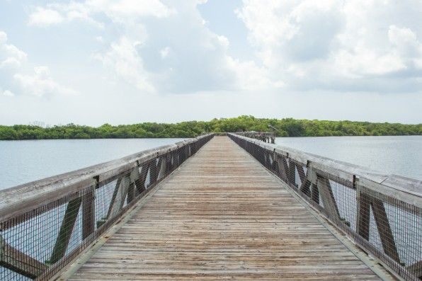 Walkway across lagoon atJohn D MacArthur Beach State Park, North Palm Beach, Florida