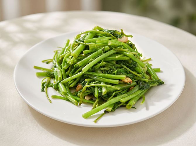 Plate of sautéed green beans on a white dish